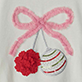 Pink ribbon bow with two red flowers and a white hat with red trim