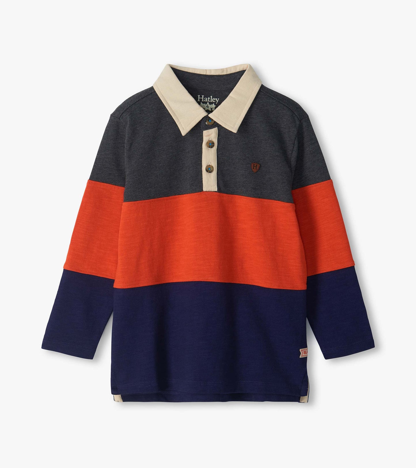 Long-sleeve colorblock polo top with cream collar, dark gray yoke, orange chest stripe, and navy lower half