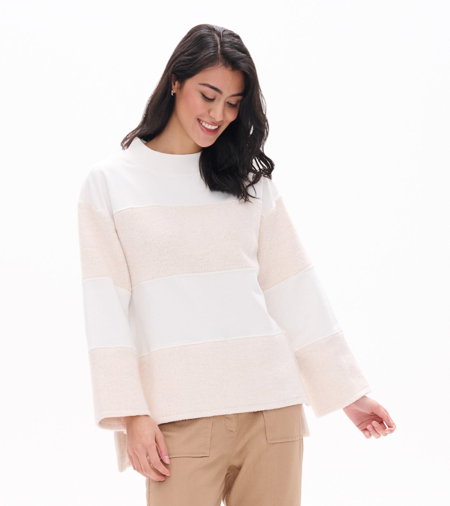 Front view of oatmeal long sleeve top with wide horizontal textured panels and relaxed fit