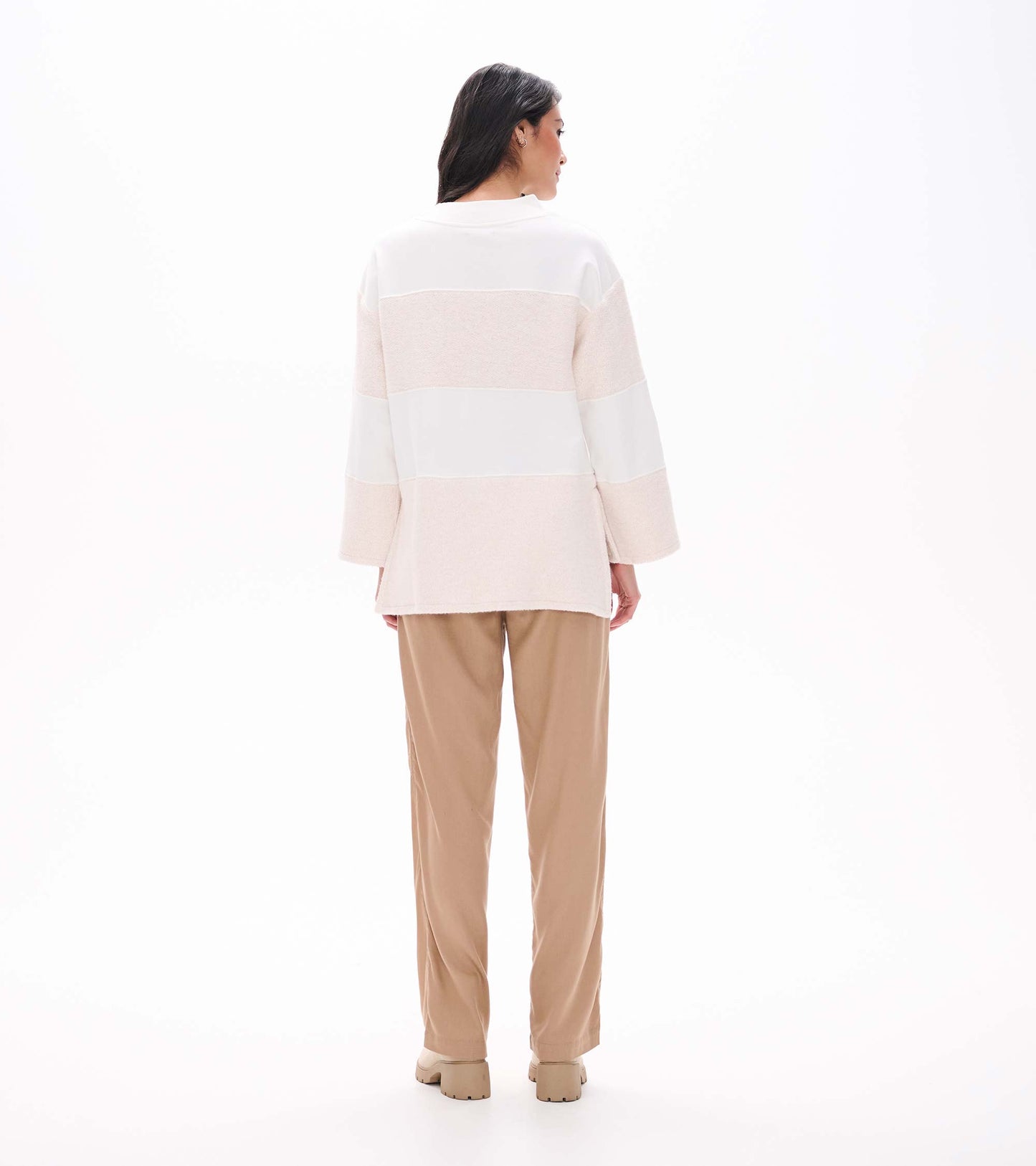 Back view of oatmeal long sleeve top with horizontal textured panels and straight high-low hem