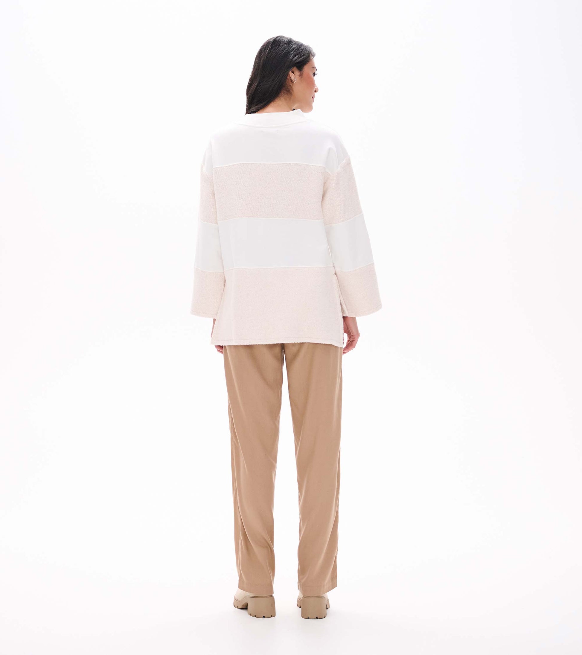 Back view of oatmeal long sleeve top with horizontal textured panels and straight high-low hem