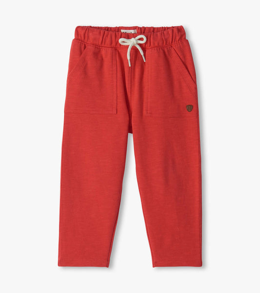 Infant pull-on pants in chrysanthemum red with elastic drawstring waist and front patch pockets