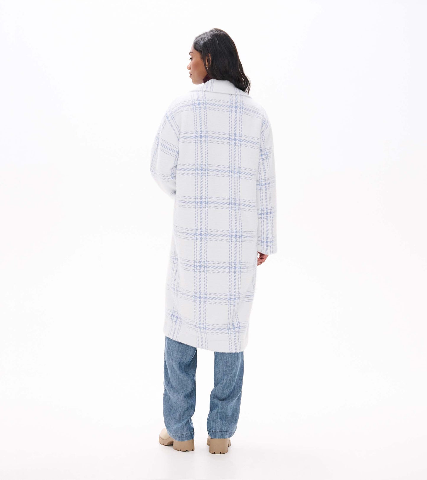 Back view of long white jacket with light blue plaid and straight silhouette