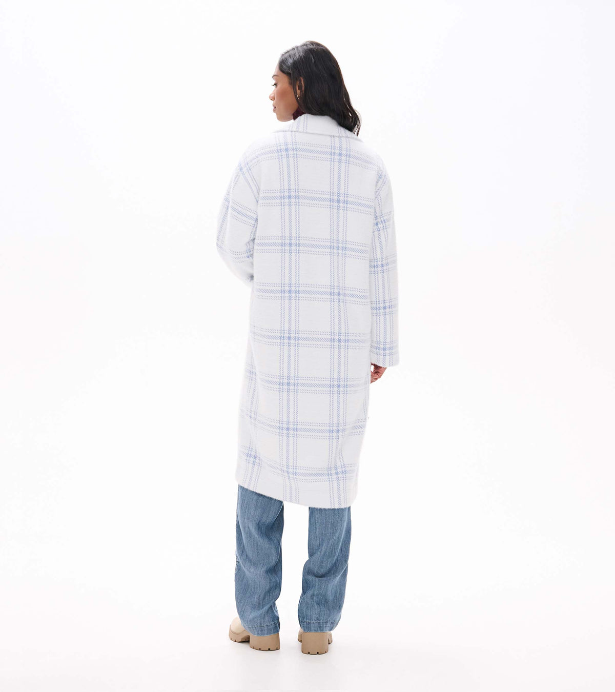 Back view of long white jacket with light blue plaid and straight silhouette
