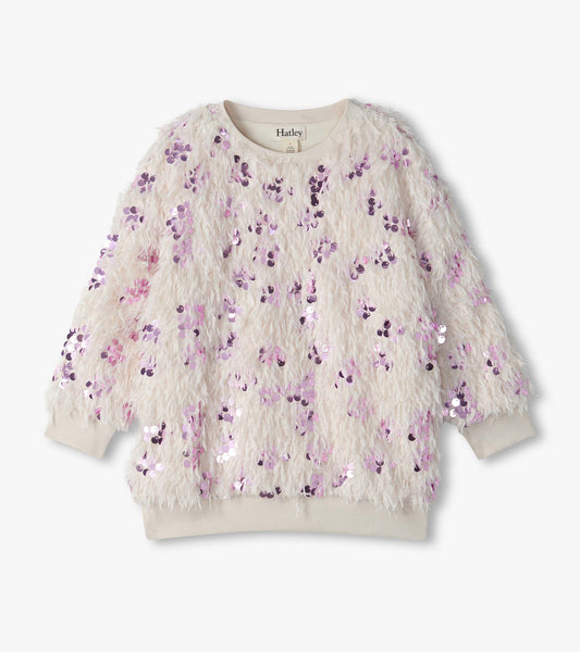 Cream pullover with shaggy feather-like texture, pink sequins, and ribbed crew neck, cuffs, and hem