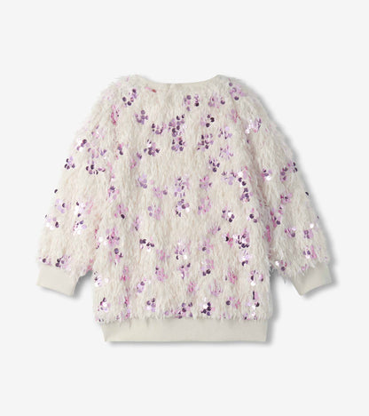Back view of cream feather-textured girls pullover with scattered pink sequins and ribbed hem