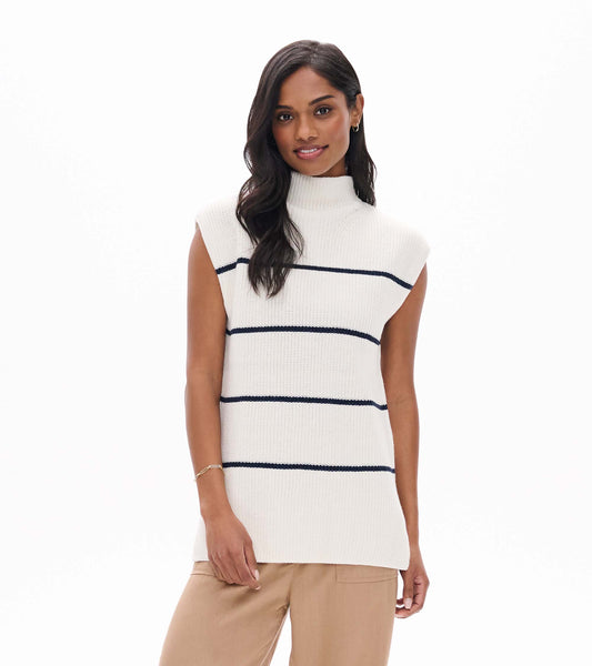 Front view of cream sleeveless sweater tunic with navy stripes and mock neck on model
