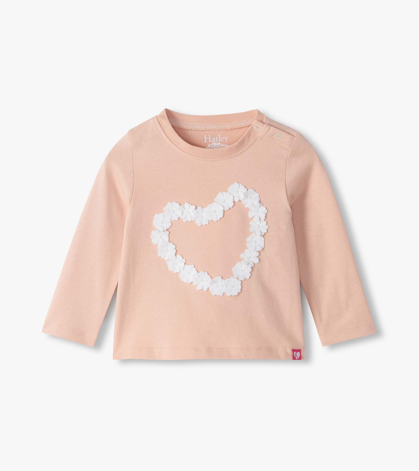 Infant blush pink long sleeve tee with white flower heart on front and shoulder snaps