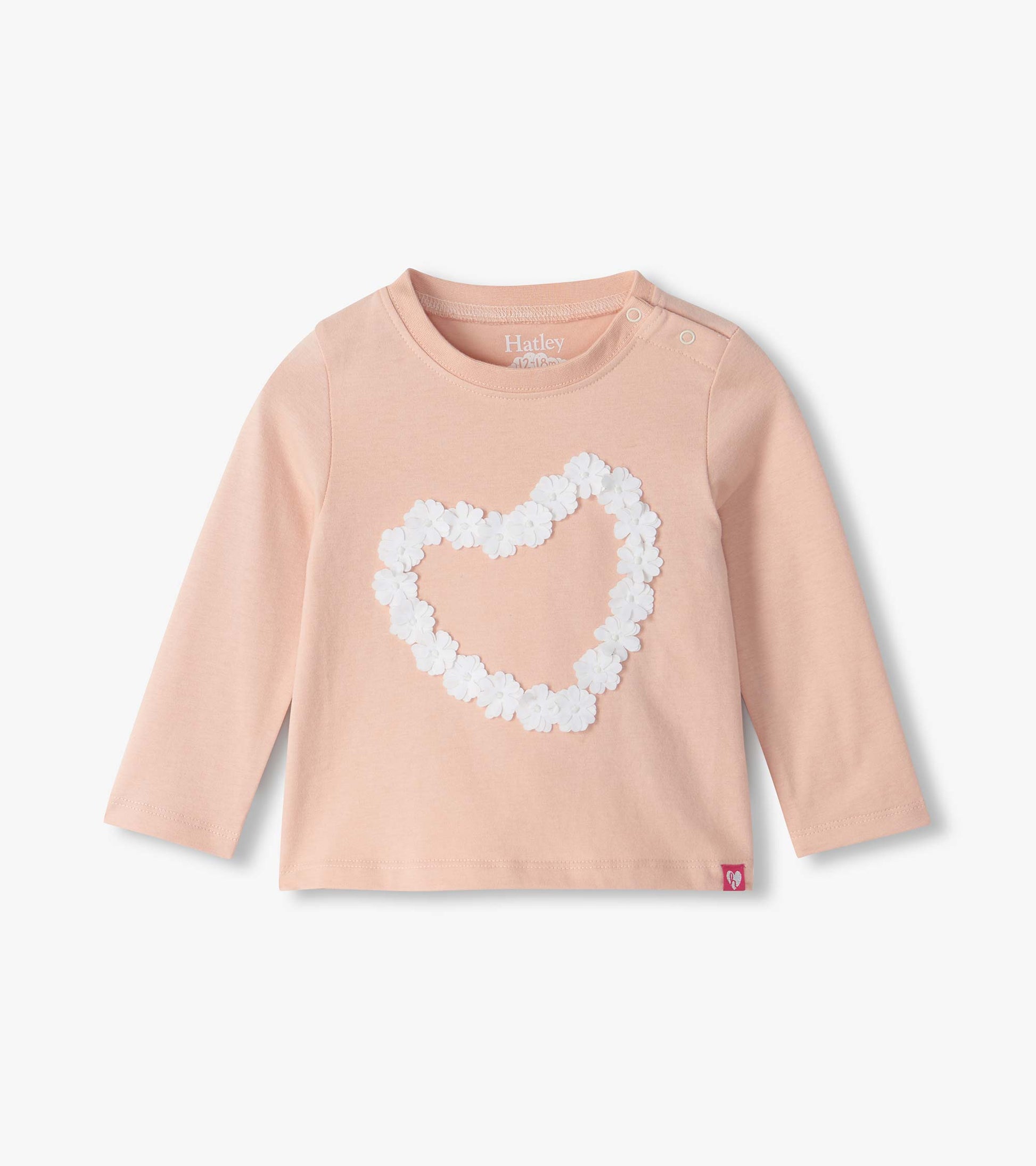Infant blush pink long sleeve tee with white flower heart on front and shoulder snaps