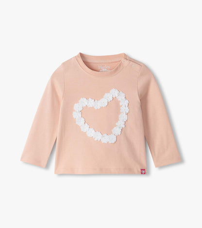 Infant blush pink long sleeve tee with white flower heart on front and shoulder snaps