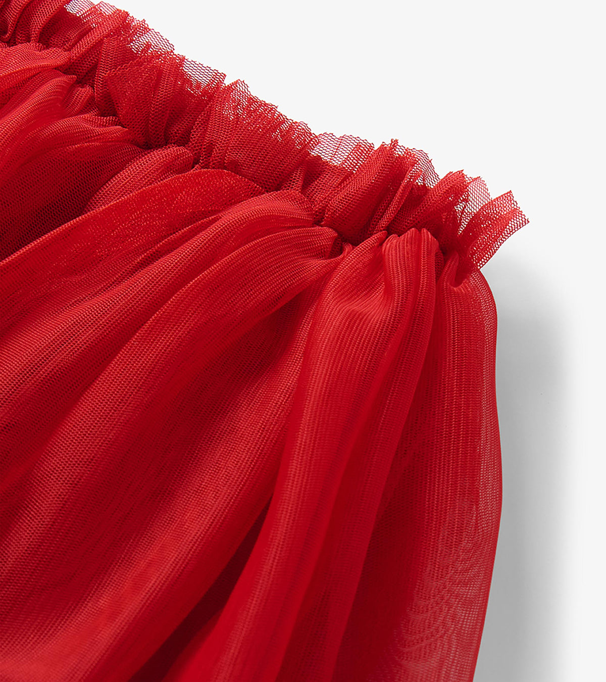 Close-up of the red tutu skirt waistband and gathered layered tulle