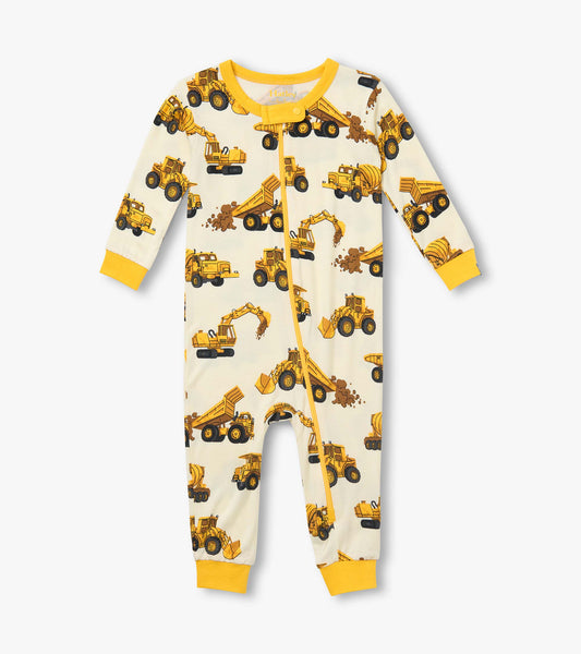 Front view of infant coverall with yellow trim, zipper, and allover construction truck print