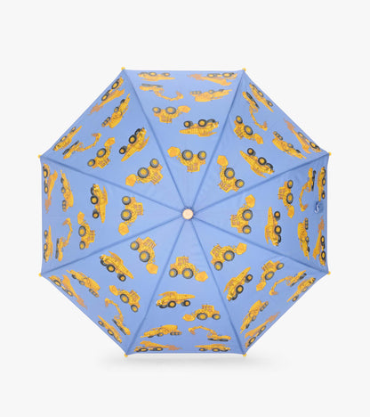 Top view of open blue umbrella with yellow construction vehicles printed across the canopy