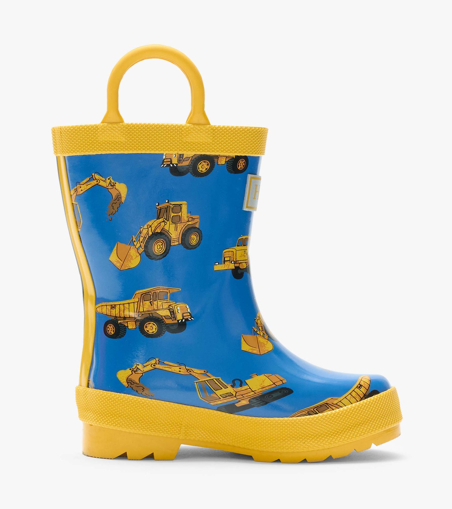 Side view of blue rain boot with yellow handles and construction vehicle print