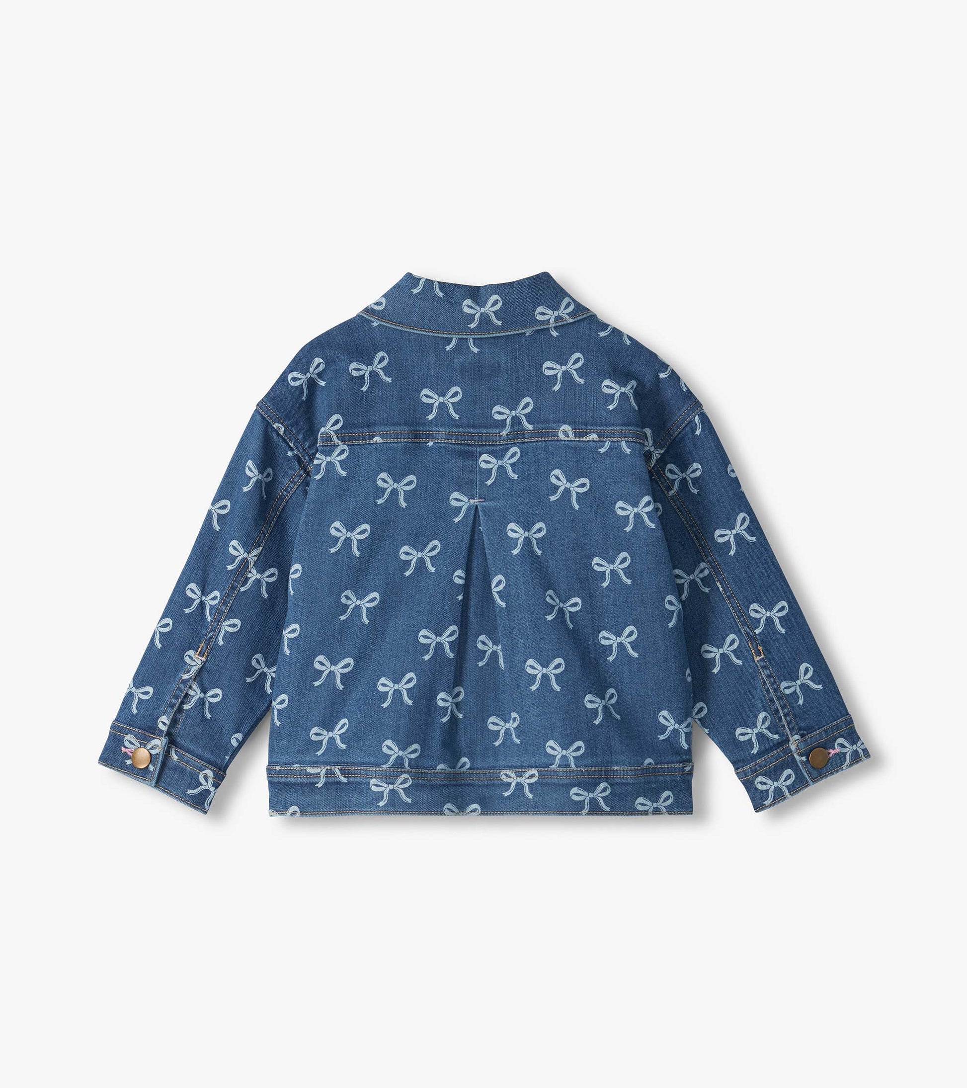 Back view of blue slouchy denim jacket with allover bow print, pleated back and button cuffs