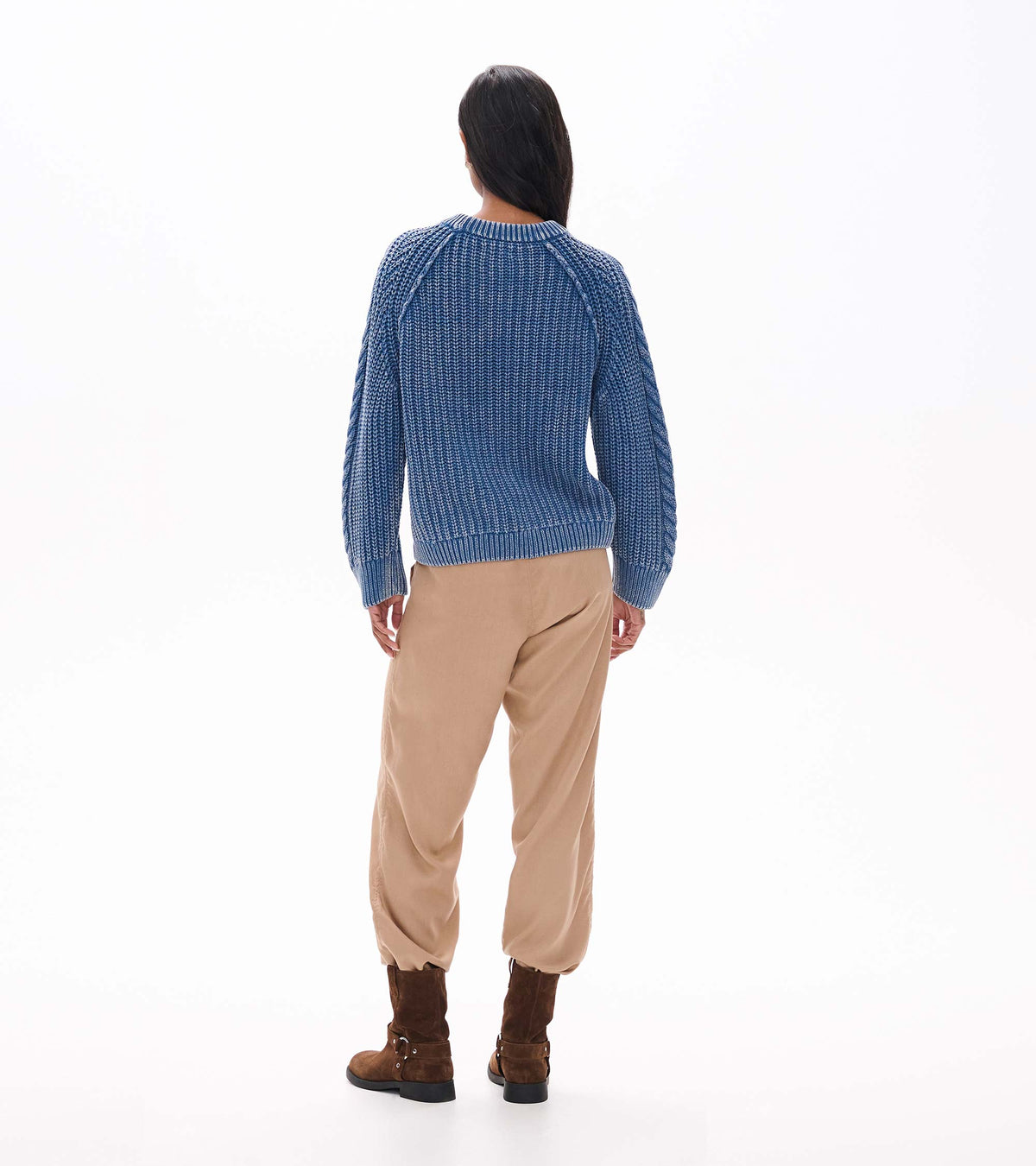 Back view of stellar blue knit sweater with ribbed hem and cuffs