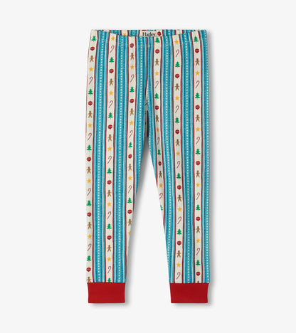 Kids holiday pajama pants with red cuffs, blue striped pattern, and trees, candy canes, stars, ornaments, and gingerbread
