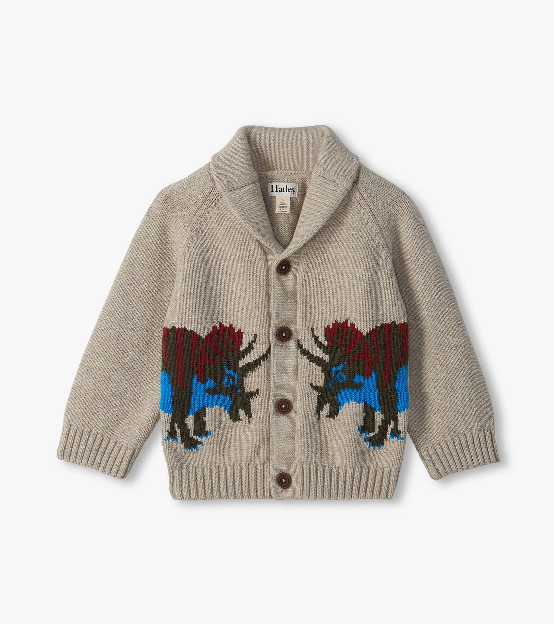 Beige shawl collar cardigan with brown buttons and blue and red dinosaur pattern around the lower half