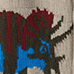 Knitted pattern with a blue face, red hair, and black antlers