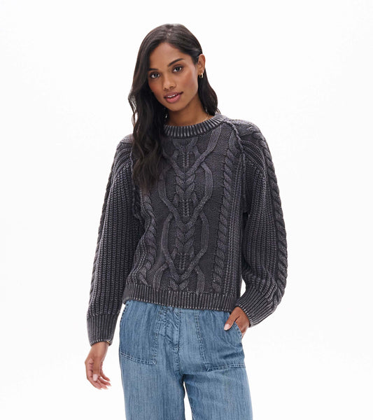 Front view of dark charcoal cable knit sweater with crew neckline and ribbed cuffs and hem