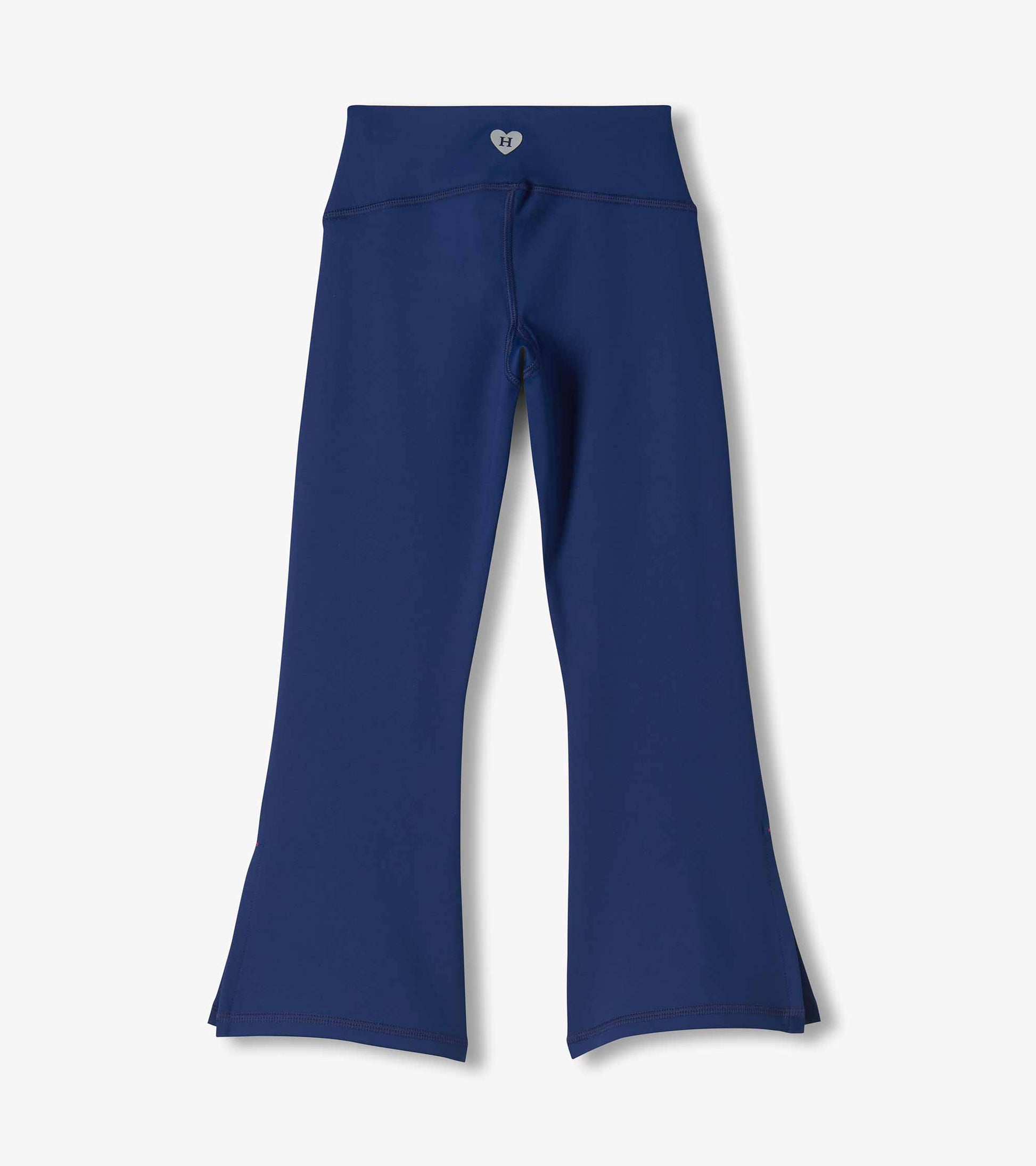 Back view of girls estate blue flared active pants with a wide waistband and flared legs