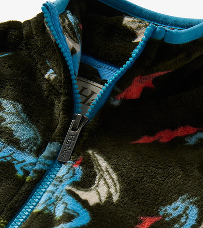 Close-up of jacket collar and bright blue zipper with dragon print fleece and Hatley zipper pull