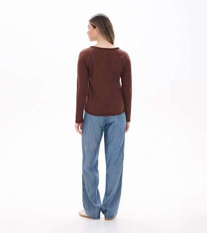 Back view of brown long sleeve raglan tee with a wide neckline and curved hem