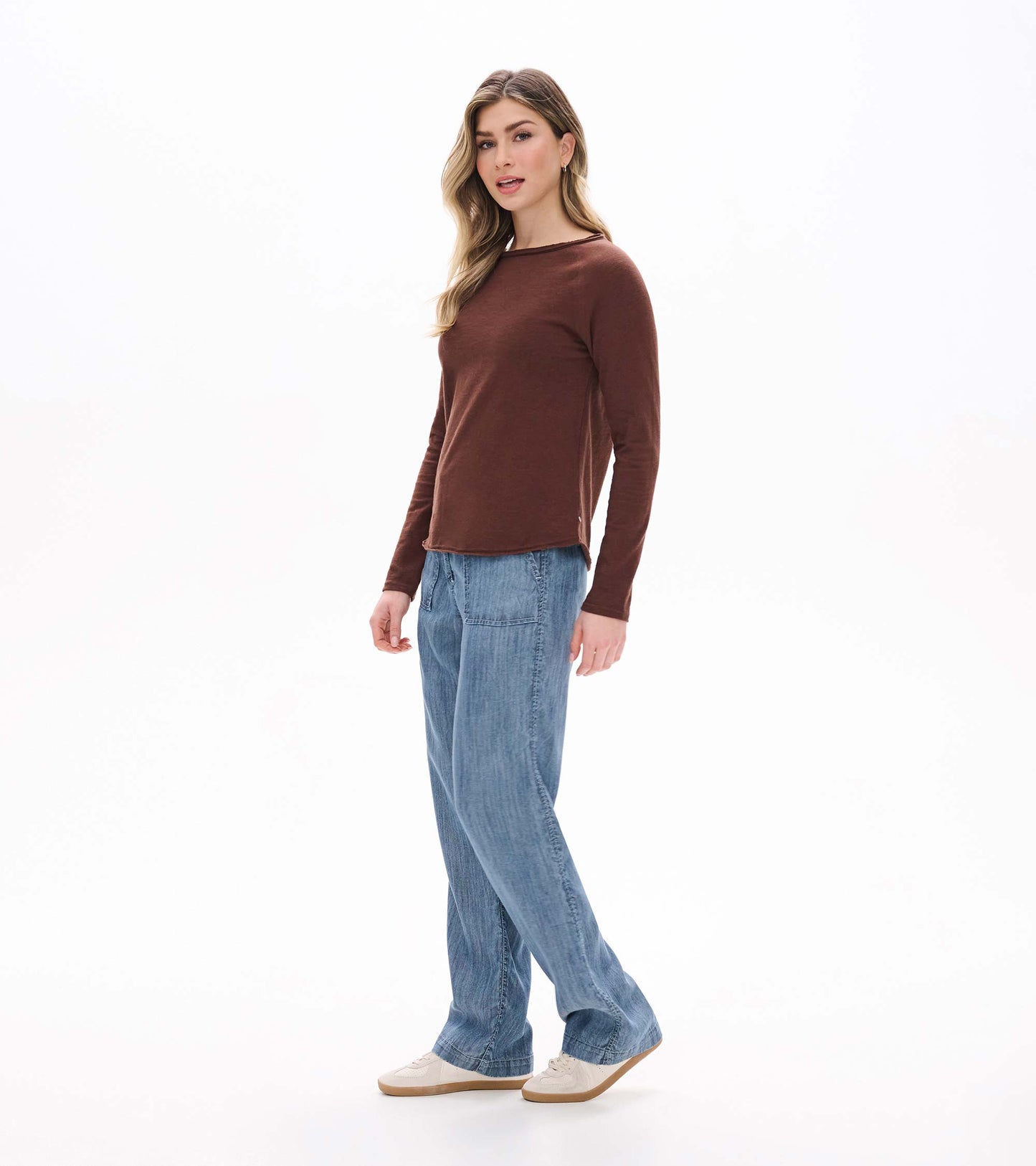 Side front view of brown raglan sleeve tee with long sleeves and a wide neckline