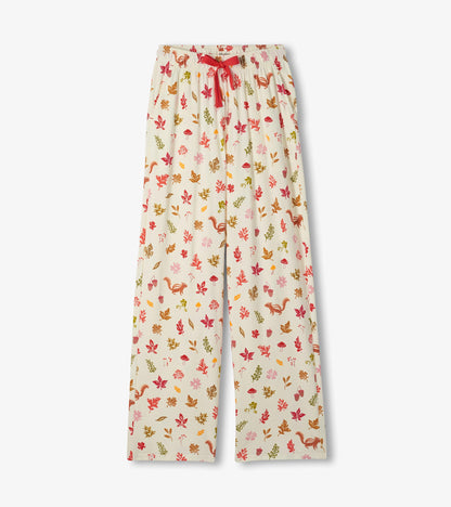 Pajama pants with red drawstring and fall print of leaves, acorns, mushrooms, and squirrels