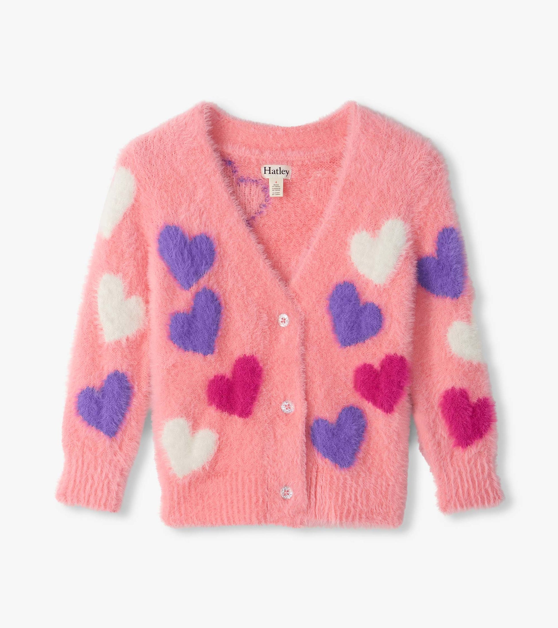 Front view of pink fuzzy cardigan with white, purple, and bright pink hearts and button front
