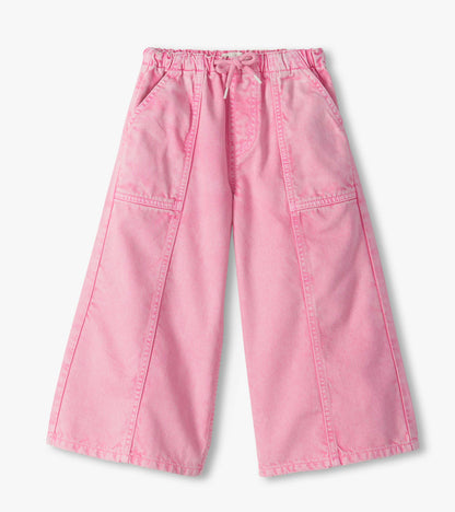 Front view of girls flamingo pink wide leg jeans with elastic waistband, drawcord, and front pockets