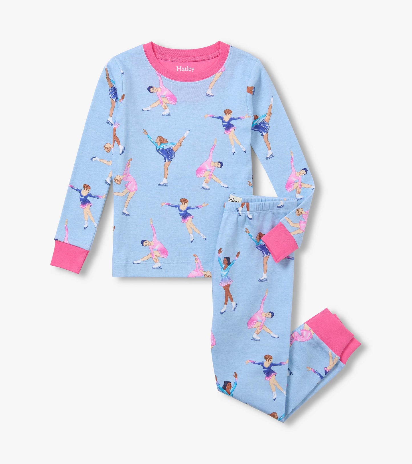 Kids pajama set in light blue with figure skater print, pink neckband and cuffs, shown folded