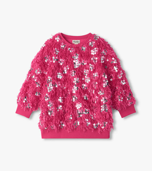 Front view of fuchsia pullover with shaggy feather-like texture, silver sequins, and ribbed cuffs and hem