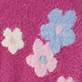Pink textured surface with three flower shapes, two light pink and one light blue