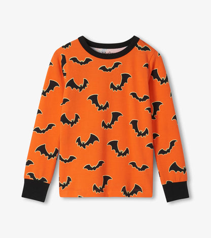 Orange long sleeve pajama top with black bat print and black neck and wrist cuffs
