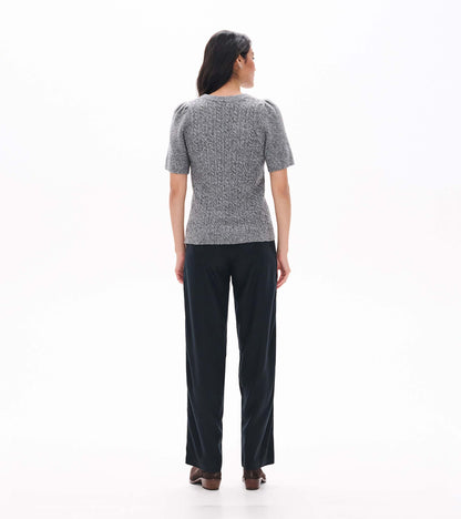 Back view of grey boucle sweater with short puff sleeves and a fitted ribbed silhouette