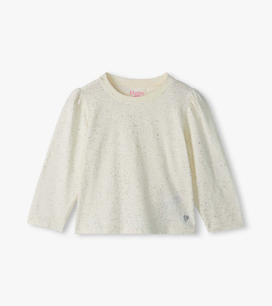 Front view of cream infant tee with silver glitter speckles, puff shoulders, and small heart at hem