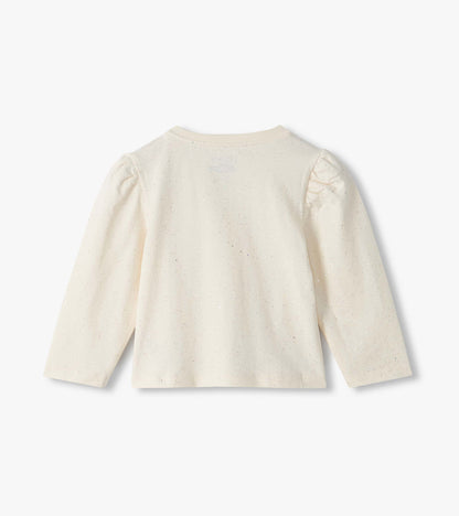 Back view of cream infant tee with subtle glitter speckles and puff shoulders