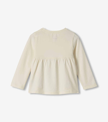 Back view of cream long-sleeve toddler T-shirt with gathered back waist seam