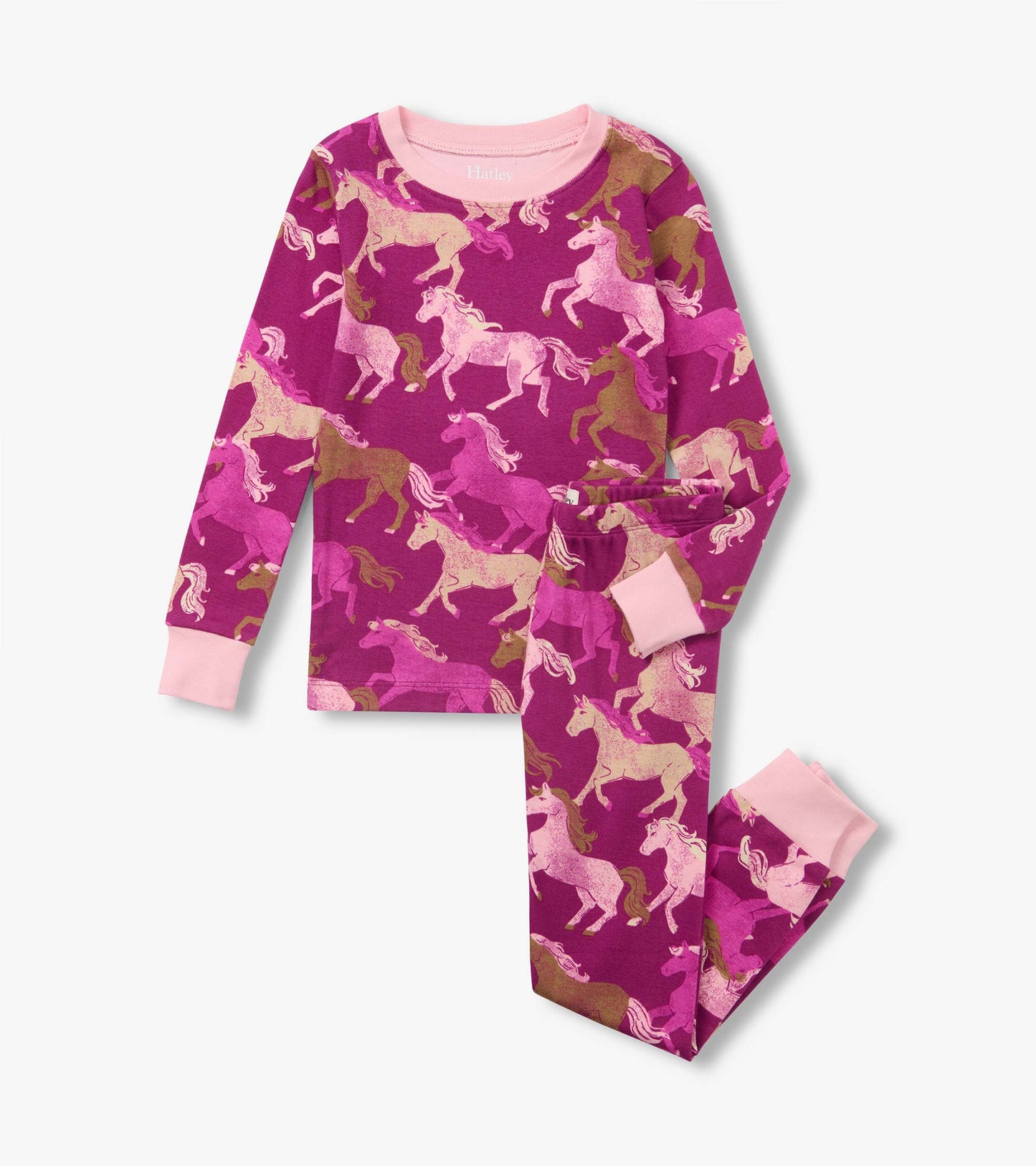 Kids pajama set with pink cuffs and an allover galloping horse print in pink and brown on a magenta background