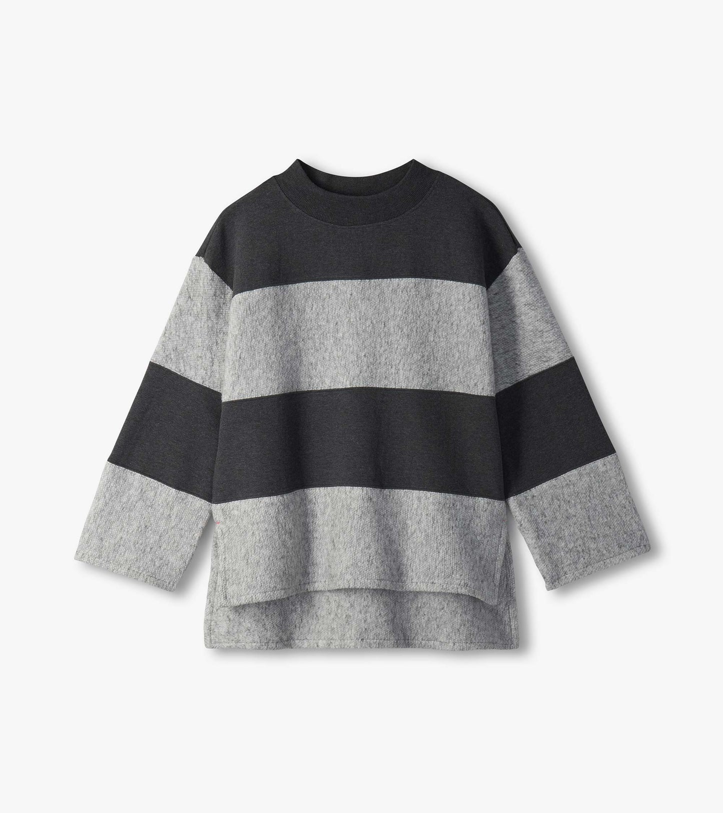 Flat lay of charcoal and light gray striped long sleeve top with mock neck and high-low hem