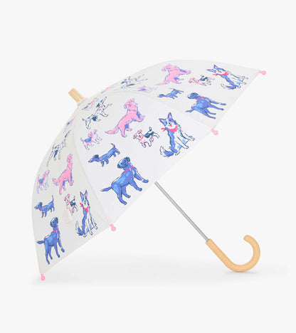 Open clear kids umbrella with pink and blue dog print, pink tips, and a curved wood-look handle