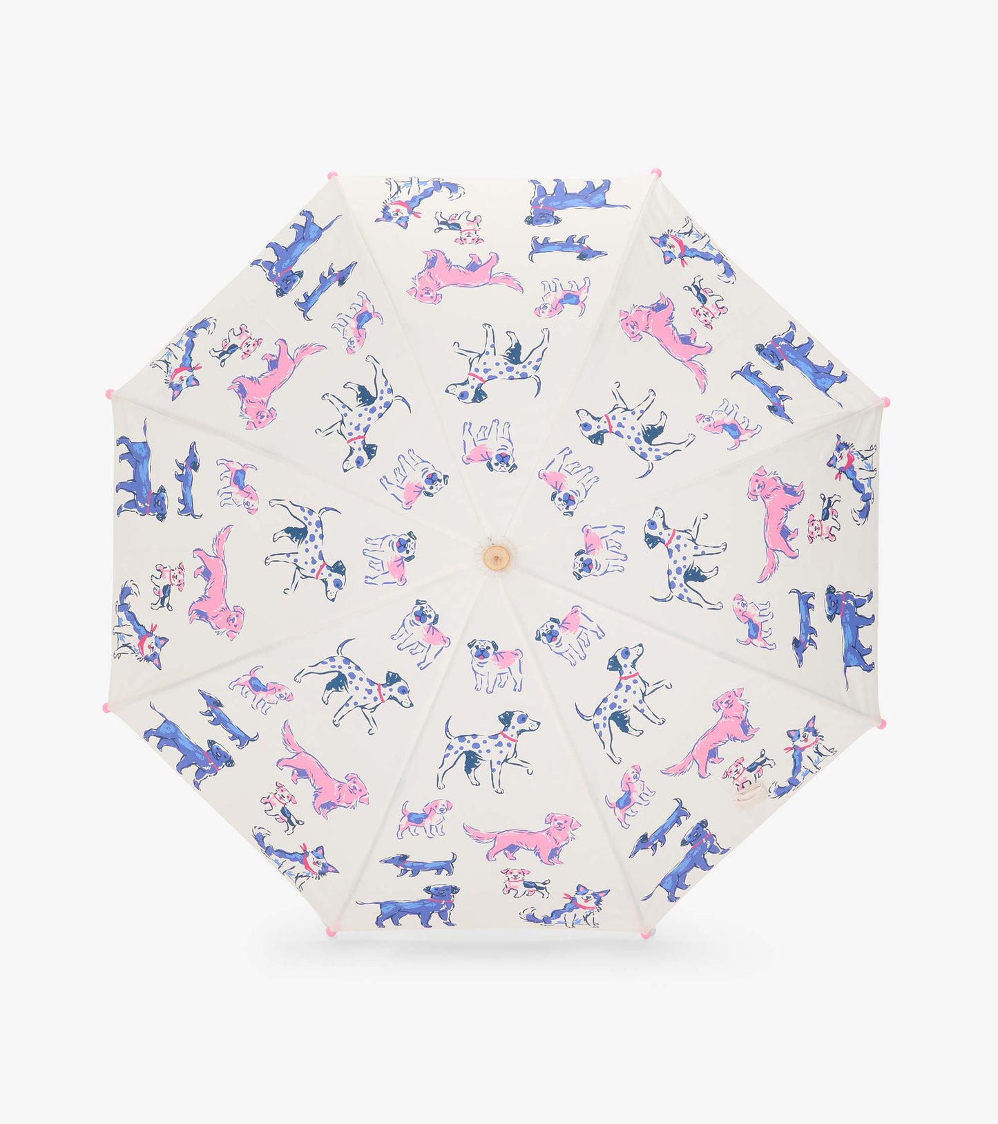 Top view of clear umbrella canopy with pink and blue dog illustrations and pink tip caps