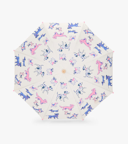 Top view of clear umbrella canopy with pink and blue dog illustrations and pink tip caps