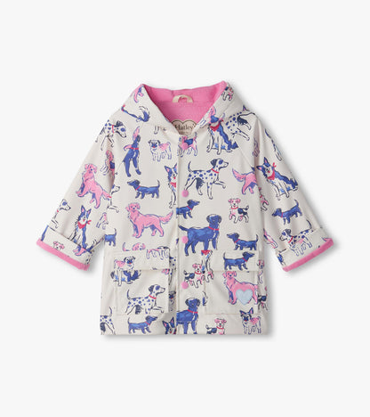 Front view of infant rain coat with pink lining, snap front, flap pockets, and blue and pink puppy print