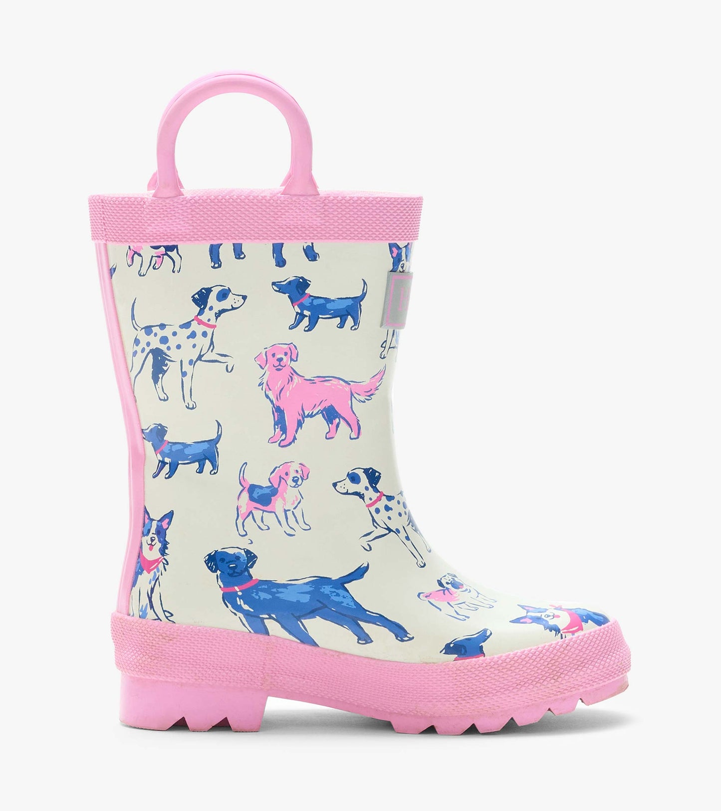 Single cream rain boot with pink handle and trim, shown in side view with blue and pink dog print