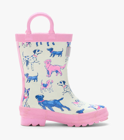 Single cream rain boot with pink handle and trim, shown in side view with blue and pink dog print
