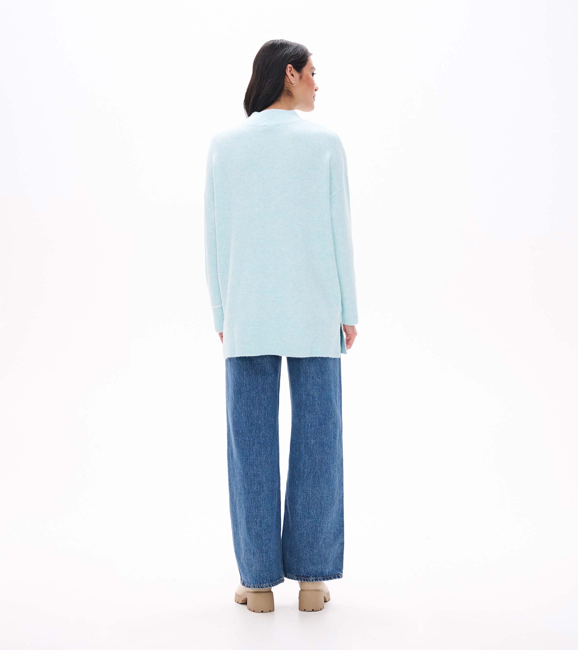 Back view of teal tunic sweater with mock neck, long sleeves and ribbed hem