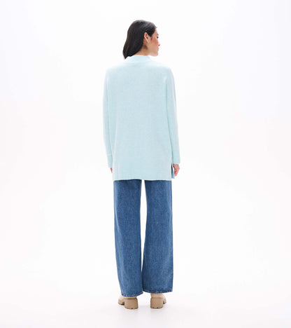 Back view of teal tunic sweater with mock neck, long sleeves and ribbed hem