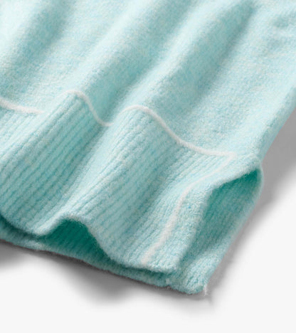 Close-up of the teal Digital Stripe Sweater hem with ribbed knit trim